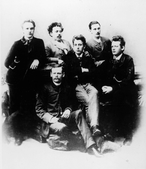 Reger and his fellow students in Wiesbaden (1891), back row: Hans
                        Schmid, Gustav Cords, Geritt Kreling; front row: Adolf Pochhammer, Georg
                        Behrmann, Max Reger. Photography, presented to  on his birthday on 18 July
                        1891. – Printed in , p. 104.